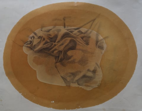 A study of crumpled fabric over a rounded ochre-colored area.